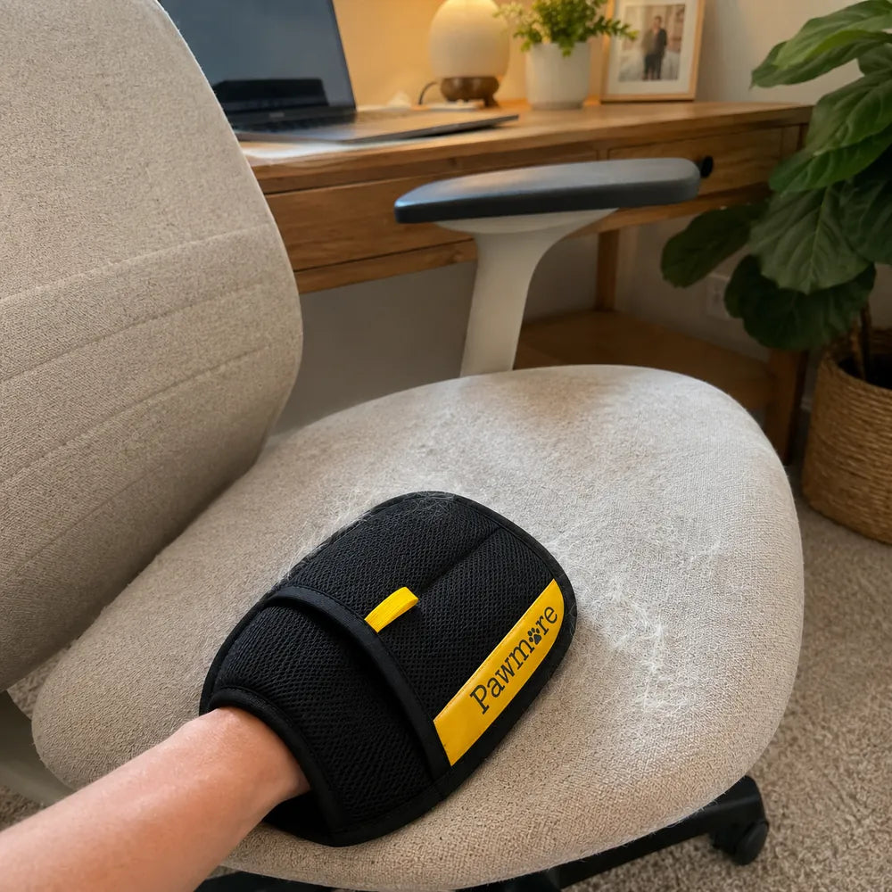 Customer proof showing FurSweep Mitt cleaning pet hair from a desk chair.