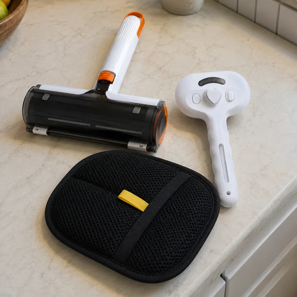 The three Fur-Free Home Kit tools arranged together on a light kitchen counter.