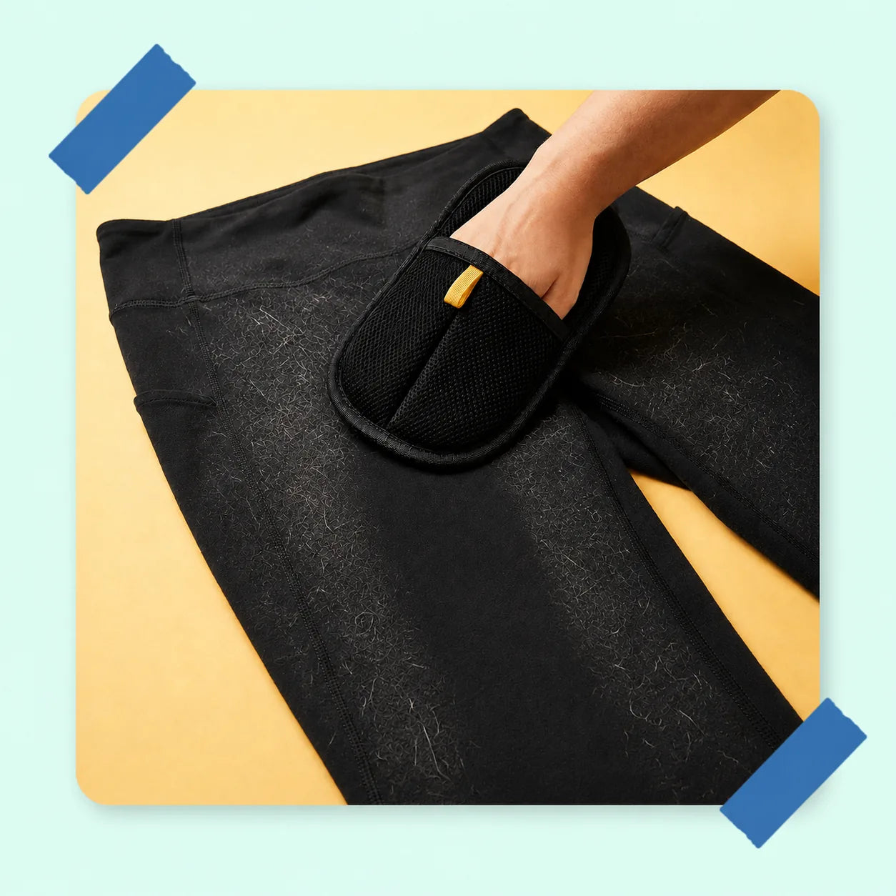 FurSweep Mitt swiping pet hair from clothes.