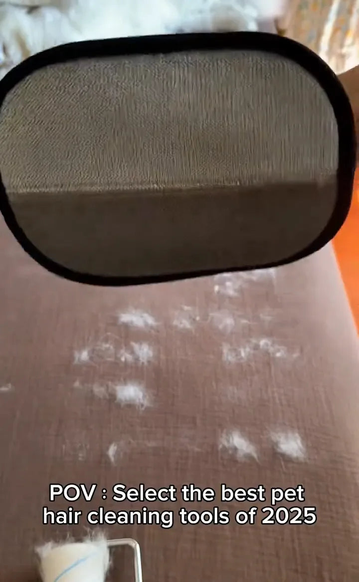 FurSweep Mitt cleaning pet hair from brown upholstery.