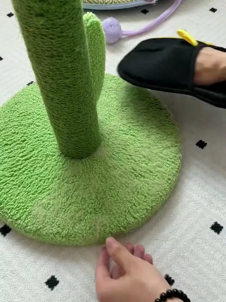FurSweep Mitt removing cat hair from a textured cat tree.