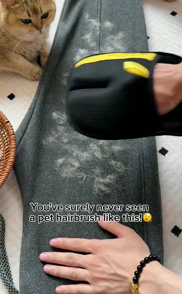FurSweep Mitt rapidly clearing cat hair from dark upholstery.