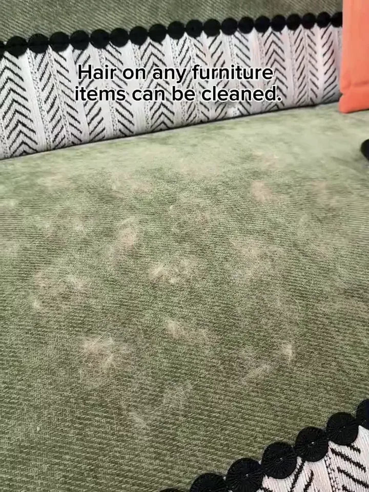 FurSweep Mitt rapidly clearing pet hair from a green sofa.